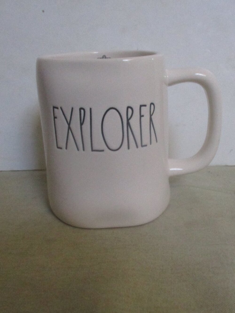 RAE DUNN Explorer Mug with a little Back Pack etch inside